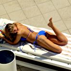 Fourth pic of Amy Willerton sunbathing in blue bikini