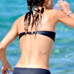 First pic of Vanessa Paradis sunbathing topless on the beach in Corsica
