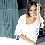 Third pic of French singer Alizee posing in white clothing photoshoot