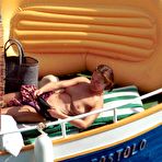 Second pic of Carole Bouquet swimming & sunbathing topless on the yacht