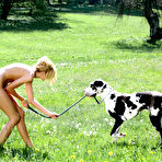 Fourth pic of Jitka Branich - Jitka Branich strips outdoors in the park and poses along with her pet dog.