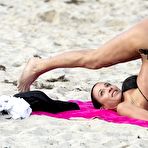 Second pic of Federica Torti yoga in black bikini on a beach