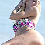 Fourth pic of Candice Swanepoel in bikini on a beach & yacht