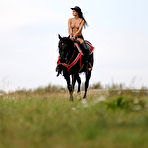 First pic of Melisa Mendiny - Melisa Mendiny rides her strong black horse outdoors wearing nothing but pants.