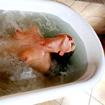 Third pic of Mira A - Mira A strips her lingerie in the bath tub and shows us her massive round jugs.