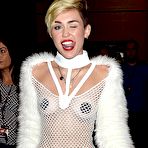 Second pic of Miley Cyrus without bra under fishnet dress