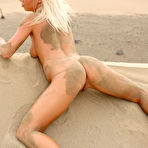 Third pic of Natali Blond - Hot blonde bitch Natali Blond strips on the beach and shows her bouncy big jugs.