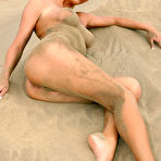 Fourth pic of Natali Blond - Hot blonde bitch Natali Blond strips on the beach and shows her bouncy big jugs.