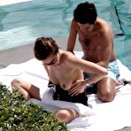 Second pic of French journalist and TV presenter Melissa Theuriau topless on a beach and poolside paparazzi shots