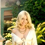 Second pic of Sandy Summers - Blonde angel, Sandy Summers sits in the shade and slowly takes off her clothes.