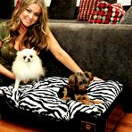 Second pic of Carmen Electra posing in home with her doggies