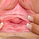 Third pic of Nurse Bridgit masturbating with big dildo and speculum at gyno clinic