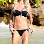 First pic of Victoria Silvstedt in black bikni on a beach