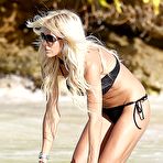 Third pic of Victoria Silvstedt in black bikni on a beach