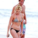 Third pic of Margot Robbie wearing a bikini on a beach
