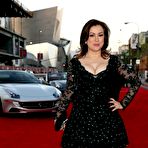 Second pic of Jennifer Tilly posing for paparazzi, shows legs