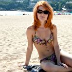 Fourth pic of Incredible redhead Mia Sollis displays her stunning figure outdoors on the beach after stripping.