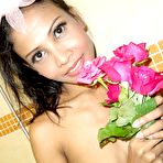 Fourth pic of Leggy Thai beauty Indyah strips to take a flower petal bath