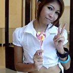 First pic of Sexy schoolgirl Thai baby named O sucks a lolipop and shows off her bald pussy