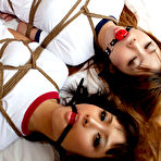 Fourth pic of Dimdim Asian and nasty babe in t-shirts are tied in ropes on bed