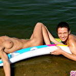 First pic of Adorable nudists with perfect asses relaxing on the air bed. Enjoy the pics