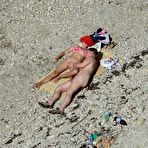 Fourth pic of Overheated beach nudists sunbathing and feeling up