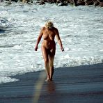 Second pic of Fired up nudists fool around and sunbath on a beach