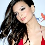 Fourth pic of Emily Ratajkowski posing in red, shows cleavage