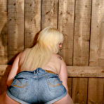 Third pic of Natural big breasts fatty country babe poses in the barn