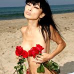 First pic of Bai Ling topless but covered in Malibu