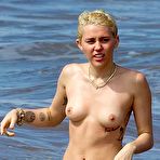 Fourth pic of Miley Cyrus caught topless on a beach