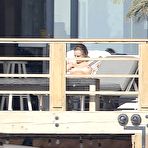 Second pic of Cara Delevingne sunbathing topless on a balcony