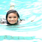 Third pic of Tiny Thai babe Panni swimming nude outside at the pool
