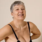 Fourth pic of Naughty British mature lady getting dirty