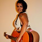 Second pic of Andria Zammi and a Guitar