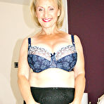 Second pic of Busty mature slut in stockings show her aged holes at Michelle's Nylons