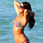 Second pic of Claudia Romani shows cleavage in leopard bikini on the beach