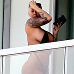 First pic of Amber Rose flashing her ass on a balcony