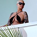 Second pic of Amber Rose flashing her ass on a balcony
