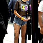 Fourth pic of Miley Cyrus in shorts & see through shirt