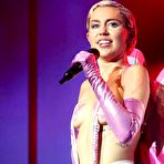 Third pic of Miley Cyrus almost topless on a stage at 2015 Adult Swim Upfront Party