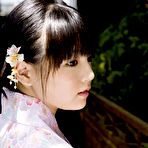 First pic of Asian babe shows of massive tits as she takes off her kimono