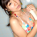 Third pic of Sweet Ayana Tanigaki smiles and poses at the kitchen with banana