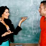 Second pic of Busty teacher babe Romi Rain wears hot stockings and bangs her student on her desk