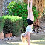 Second pic of Sporty bimbo Bella Bends demonstrates the erotic gymnastics under the sky