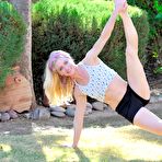 Second pic of Flexible doll Bella Bends taking cloth by cloth and finally doing gymnastics nude outdoor