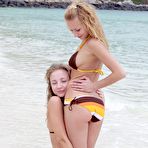 First pic of Lesbians Lilian Twistys and Nomy are on the desolate beach kissing and petting each other