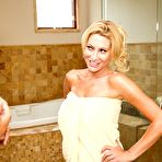 Third pic of Busty cougar Jennifer Best eats a young dude's rock hard dick after flashing him in the shower.