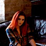 Second pic of Lucy V teasing on the sofa in plaid shirt and jeans | Web Starlets