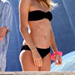 First pic of Doutzen Kroes caught in black bikini on the beach in Miami